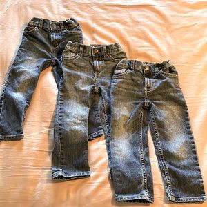 THREE pairs of 3T B’gosh jeans.